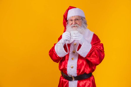 Photo for Real Santa holding a cup of coffee - Royalty Free Image