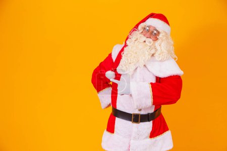 Foto de Santa Claus apuntando al lado libre para el texto del lado izquierdo - Imagen libre de derechos