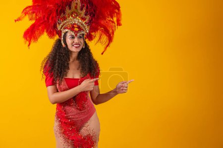 Photo for Carnival dancer woman pointing to the side. - Royalty Free Image