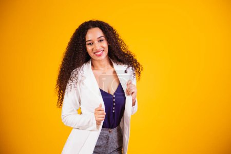 Photo for Beautiful african american woman looking at camera. Portrait of cheerful young woman with afro hairstyle. Beauty girl with curly hair. - Royalty Free Image