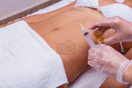 Mesotherapy treatment on marked woman's body