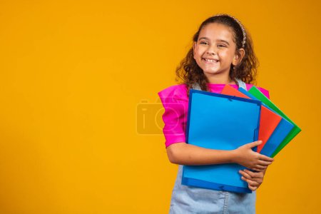 Photo for Child care and happy childhood, pretty girl with books ready to first day at school. - Royalty Free Image