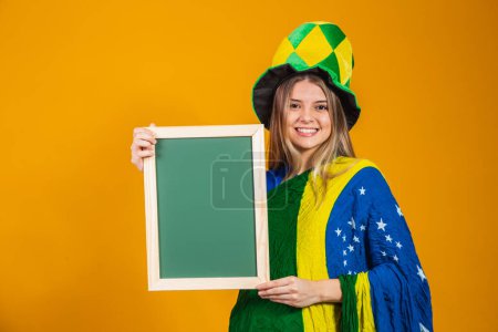 Photo for Young brazilian fan holding a placard - Royalty Free Image