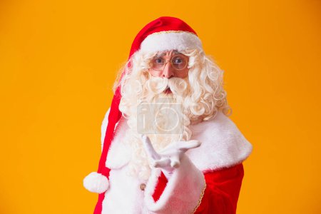 Photo for Santa Claus on yellow background. - Royalty Free Image