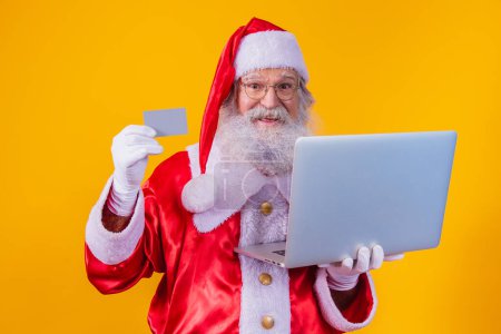 Foto de Santa Claus comprando en línea. Santa Claus compra en línea - Imagen libre de derechos