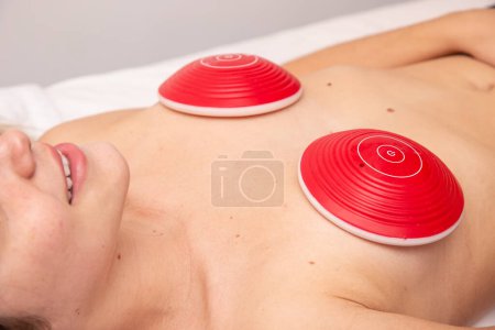 Photo for Woman undergoing bust lift procedure on breasts to reduce sagging - Royalty Free Image