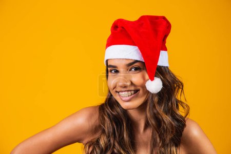 Photo for Woman in new year clothes santa hat holiday christmas - Royalty Free Image