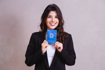 Photo for Brazilian  woman with document work and social security, (Carteira de Trabalho e Previdencia Social) - Royalty Free Image