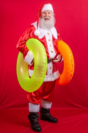 Photo for Santa Claus going on vacation in the summer - Royalty Free Image