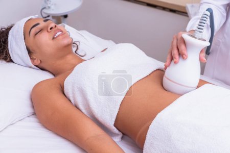 Photo for Woman doing lipocavitation in the clinic - Royalty Free Image