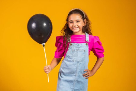 Photo for Happy little girl holding black balloon with black friday concept. sale anniversary - Royalty Free Image