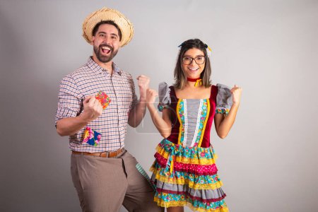 Photo for Brazilian couple dressed in festa junina clothes, feast of So Joo celebrating. - Royalty Free Image