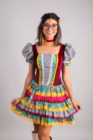 Photo for Brazilian woman dressed in festa junina clothes, feast of So Joo vertical portraits. - Royalty Free Image