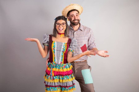 Brazilian couple dressed in festa junina clothes, feast of So Joo With open arms, welcome.