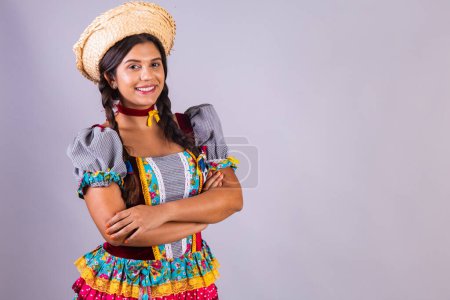 Photo for Brazilian woman, clothes from Festa Junina, Arraial, Festa de Sao Joao. crossed arms. - Royalty Free Image