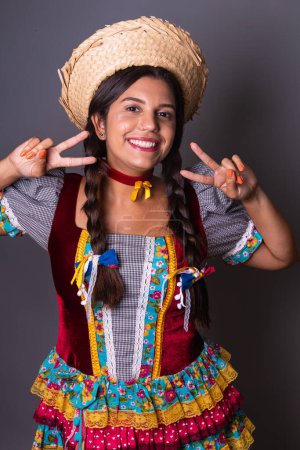 Photo for Brazilian woman, clothes from festa junina, arraial, festa de so joo. Vertical portrait - Royalty Free Image