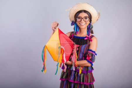 Photo for Brazilian woman with festa junina clothes. holding balloon, party decoration. - Royalty Free Image