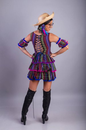 Photo for Brazilian woman with festa junina clothes. Vertical full body portrait. - Royalty Free Image