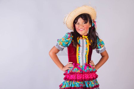 Photo for Child, Brazilian girl, in festa junina clothes, horizontal portrait. half body. - Royalty Free Image