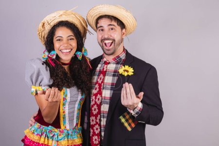 Brazilian couple, wearing June party clothes, fraternization in the name of So Joo, Arraial. close-up photo. 