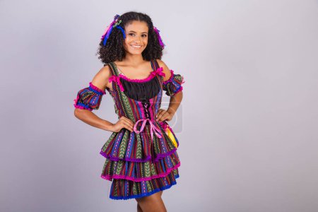 Photo for Black Brazilian woman wearing festa junina clothes. - Royalty Free Image