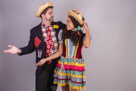 Couple, brazilian, wearing clothes from festa junina, fraternization in the name of So Joo, Arraial. welcome