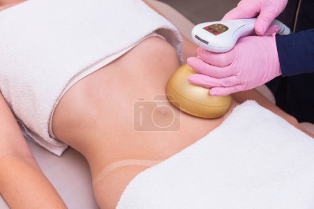Photo for Close-up photo of a woman's belly, photo of aesthetics, procedures on the abdomen. beauty clinic. ultrasound, slimming. weight loss. - Royalty Free Image