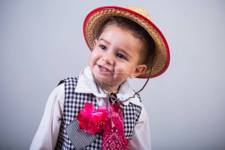 Photo for Boy, brazilian child, with clothes from festa junina, arraial, festa de so joo. Horizontal portrait. - Royalty Free Image