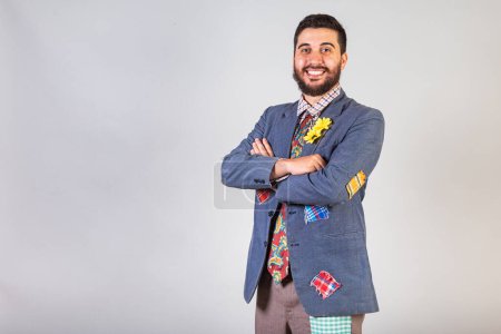 Photo for Brazilian man wearing festa junina clothes posing on grey background - Royalty Free Image