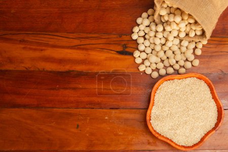Photo for Wheat, flakes and wheat, in a bowl on a wooden background - Royalty Free Image