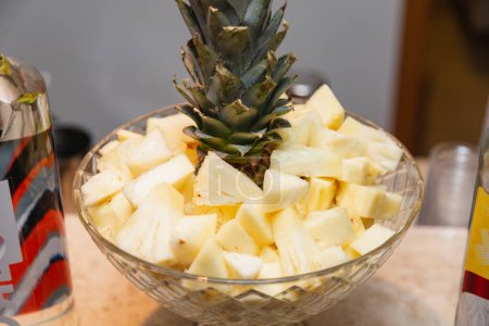 Photo for Illustrative photo of bartender, bar services. glass jar with chopped pineapple, for preparing drinks - Royalty Free Image