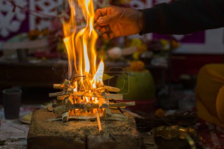 Photo for Hindu pooja ritual yagya or yajna, which is fire ceremony performed during marriage, puja and other religious occasions as per vedic traditions of sacrifice. - Royalty Free Image