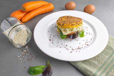 Photo for Carrot bread whit lettuce, tomato, alfalfa and sesame for breakfast - Royalty Free Image