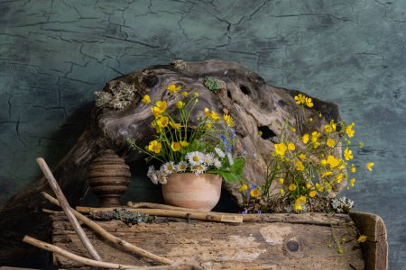 Photo for A bouquet of wild flowers in a clay pot, in an ethnic style - Royalty Free Image