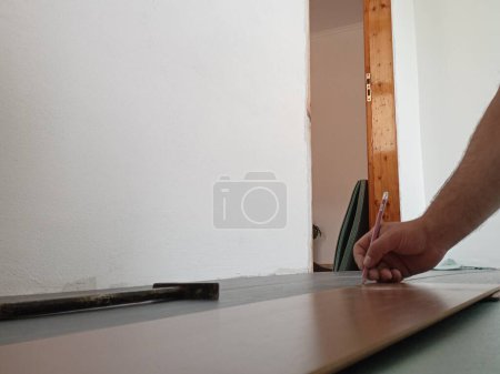 Photo for Laminate panel fitting. Laminate installation. Repair of the floor in the room - Royalty Free Image