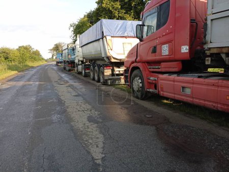 Photo for Sambirsky rayon, Lviv region, Ukraine - July 31, 2023:Many large trucks are parked on both sides of the road. A long line of trucks. - Royalty Free Image