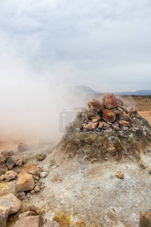 Photo for Fumarole evacuating pressurized hot sulfurous gases from volcanic activity in the geothermal area in Iceland - Royalty Free Image