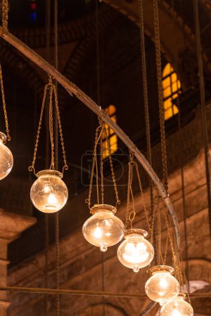 Photo for Close up of hanging glass light globes inside a mosque in Cairo Egypt - Royalty Free Image