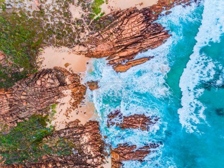 Photo for Aerial top down view of beach and clear blue water. Ocean waves on the beach as a background. Beautiful natural summer vacation holidays background. Wyadup Rocks, Western Australia. Coastal seascapes - Royalty Free Image