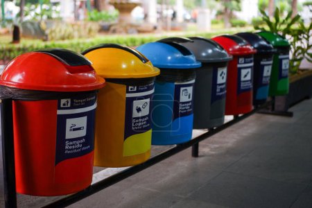 seven colorful trash cans to be thrown away and separated