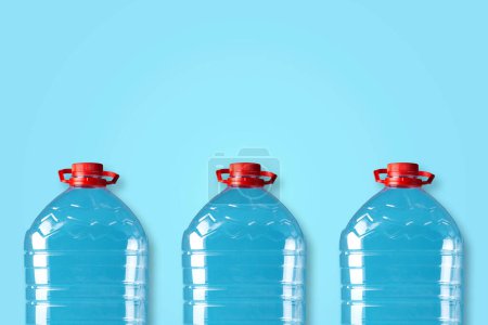 Plastic bottles on a blue background. Copy space. Products, packaging, storage recycle