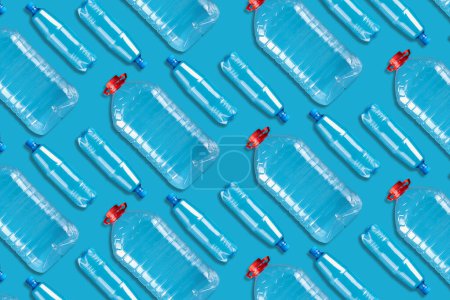 Lot of plastic bottles on a blue background. Products, packaging, storage, recycling.