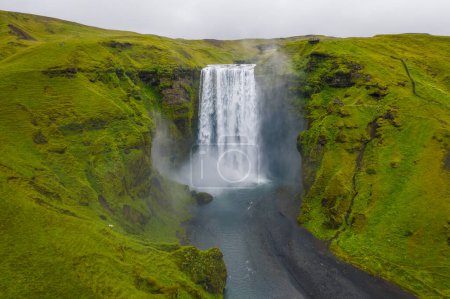 Iceland. Aerial view on the Skogafoss waterfall. Landscape in the Iceland from air. Famous place in Iceland. Landscape from drone. Travel concept.