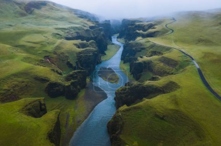 Aerial view of Fjadrargljufur Volcanic Canyon Iceland on moody overcast weather.
