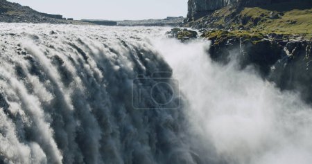 Photo for Massive and epic waterfall Dettifoss Riging water volume falling down over the edge Iceland, Europe. - Royalty Free Image
