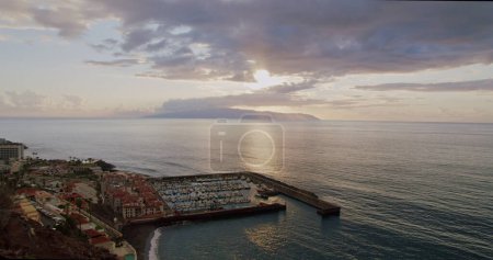 Photo for Los Gigantes during Sunset - Tenerife, Canary Islands, Spain. Volcanic beach in the Canary Islands. In the background is the Island of La Gomera. - Royalty Free Image