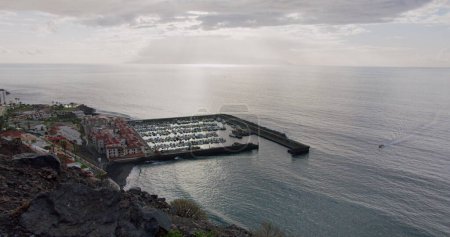 Photo for Los Gigantes during Sunset - Tenerife, Canary Islands, Spain. Volcanic beach in the Canary Islands. In the background is the Island of La Gomera. - Royalty Free Image