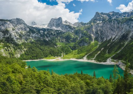 Gosau lake and Dachstein summit mountain range and visible glacier ice during summertime, Upper-Austria, Europe.