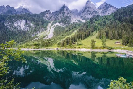 Dachstein Mountains reflected in Gosau beautiful lake, Austria.