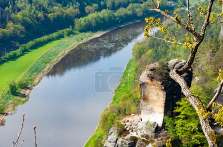 Beautiful summer view of Elbe river from Bastei view pont. Colorful morning scene of Saxon Switzerland national park, Germany, Europe. Splendid landscape of Sandstone Mountains, Saxony.